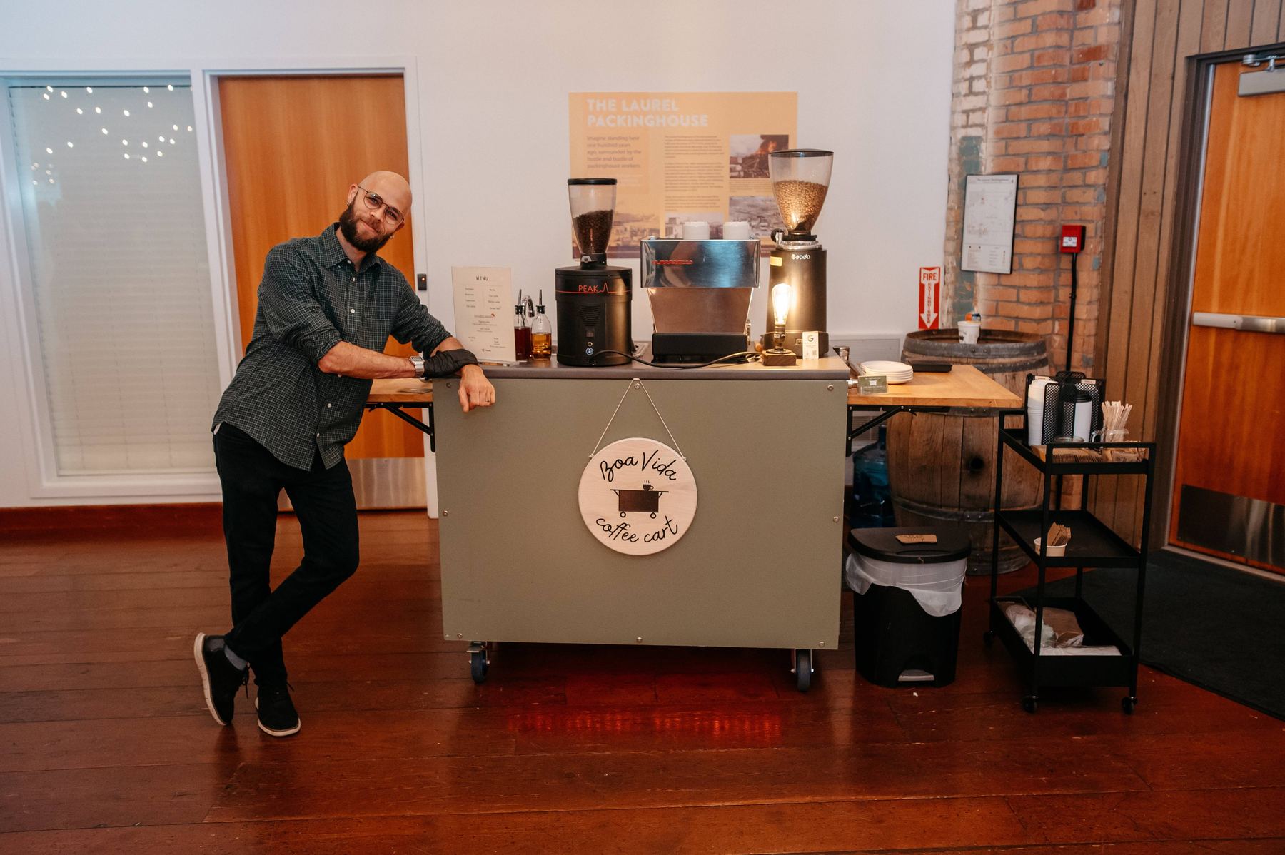 The Boa Vida Coffee cart set up and ready to serve at an indoor event venue